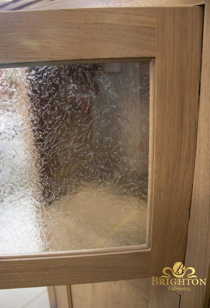 How pretty is this glass? This is a Hickory cabinet with Custom Stain and Cascade door style. The glass is Leaf print. #brightoncabinetry #cabinets #leafprint