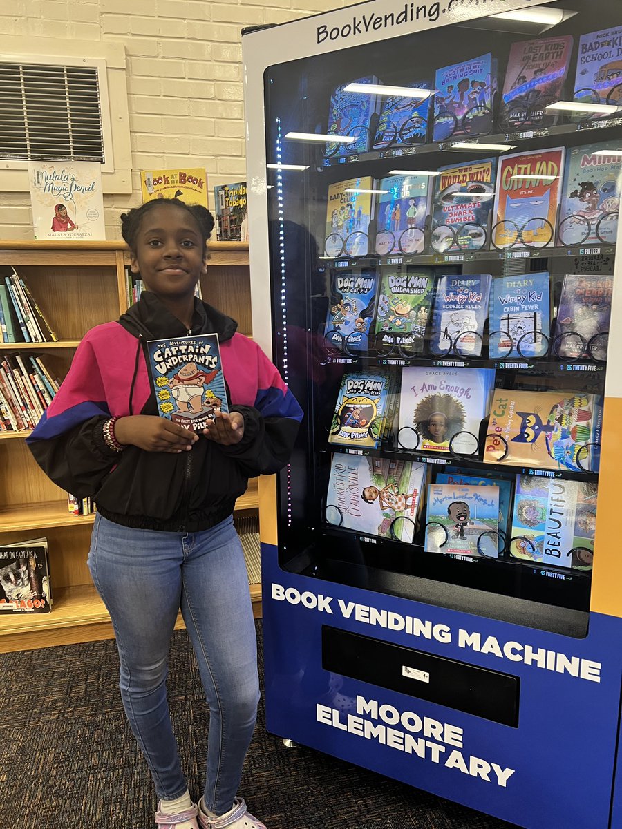 school_moore's tweet photo. We caught this 5th Grade Scholar reading to Ms. Nash’s 5th Grade Class! Of course she earned a Golden Token for the Book Vending Machine🎉✨Way to go, Tahmiya!! We love to see it♥️📘#ReadingMatters #BookLove #BookVendingMachine #ReadingRocks #Rising6thGraders https://t.co/KMxUj0NM9O