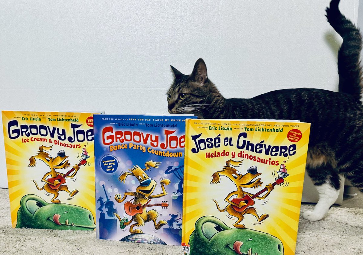 Ryanlandia's tweet photo. I received my collection of Groovy Joe books from @ericlitwinbooks today. I was feeling so groovy, I decided to do a nice photo shoot! Our cat 🐈⬛ Mochi had other plans...📸💣 After knocking the books over, Mochi upped and left!!! 😂 #groovyjoe #ericlitwin #petethecat #books #fun https://t.co/ioHZnMzQvW