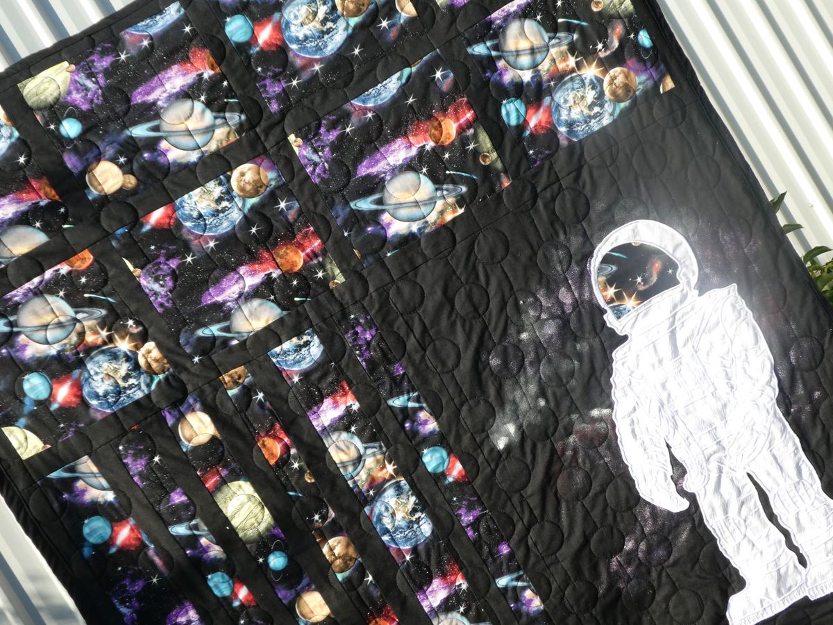 SusanBluerobot's tweet photo. My  spacequilt. I designed the embroidered spaceman and embroidered it  using 7 hooping on my big brother hoop. Then pieced the topping and  quilted the quilt before adding the spaceman https://t.co/7gU5dTdbFn