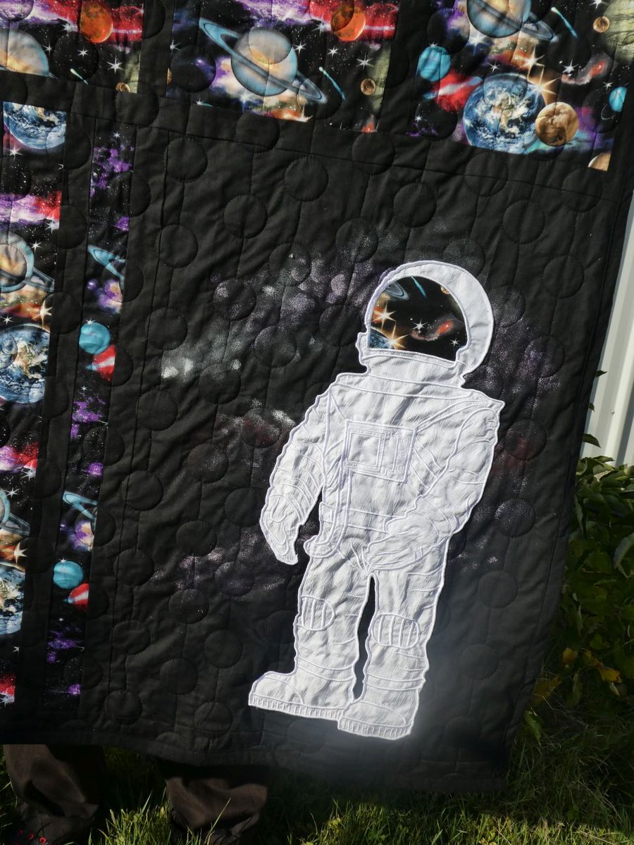 SusanBluerobot's tweet photo. My  spacequilt. I designed the embroidered spaceman and embroidered it  using 7 hooping on my big brother hoop. Then pieced the topping and  quilted the quilt before adding the spaceman https://t.co/7gU5dTdbFn
