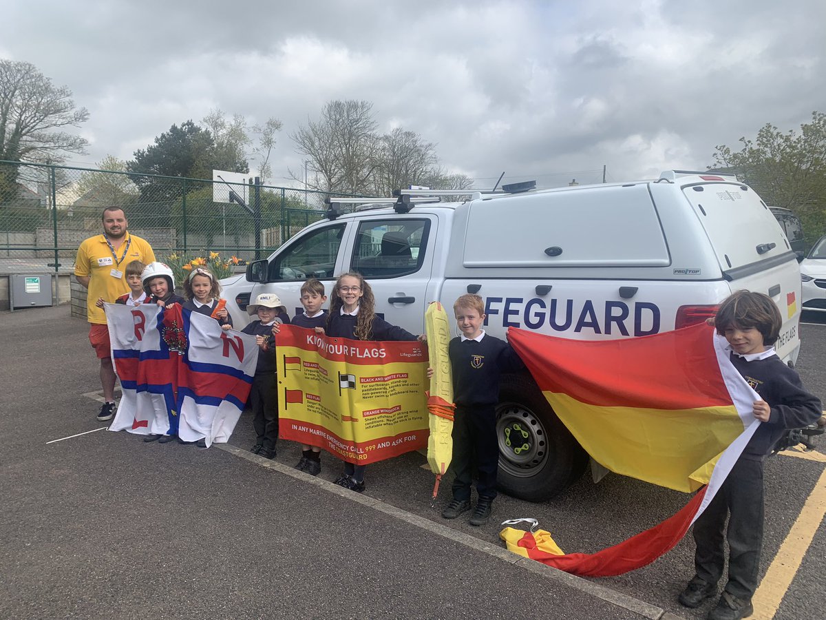 ConstantineSch2's tweet photo. A great visit from Matt and the RNLI beach lifeguards - learning about: beach flags, onshore and offshore winds, what to do if tired or swept out in a rip, how lifeguards can help you and how to call for help @Kernow_Learning  #meetthelifeguards #RNLI @RNLI https://t.co/NYz5ZBb9MD