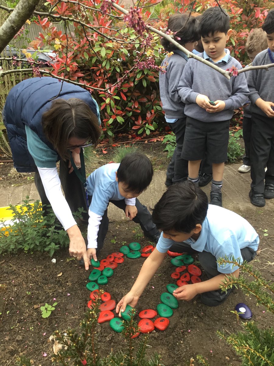 RGSprep's tweet image. Earlier in the year, each Pre-Prep boy painted a stone in their house colour and marked them with their thumbprint. This week the boys positioned their stones to create the RGS rose and crown in the Pre-Prep garden. #RGSPrep #SchoolHouse #EarlyYearsActivities #SurreyPrepSchool