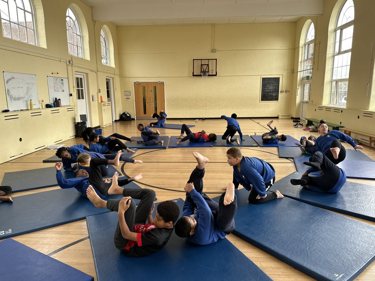 STOCSch's tweet photo. 6A are working up a real sweat! 😅! During their gymnastics lesson they were perfecting the side roll! Well done 6A 💛💙 @STOCSch @MertonSSP #gymnastics #sideroll https://t.co/wlhmAIg4IA