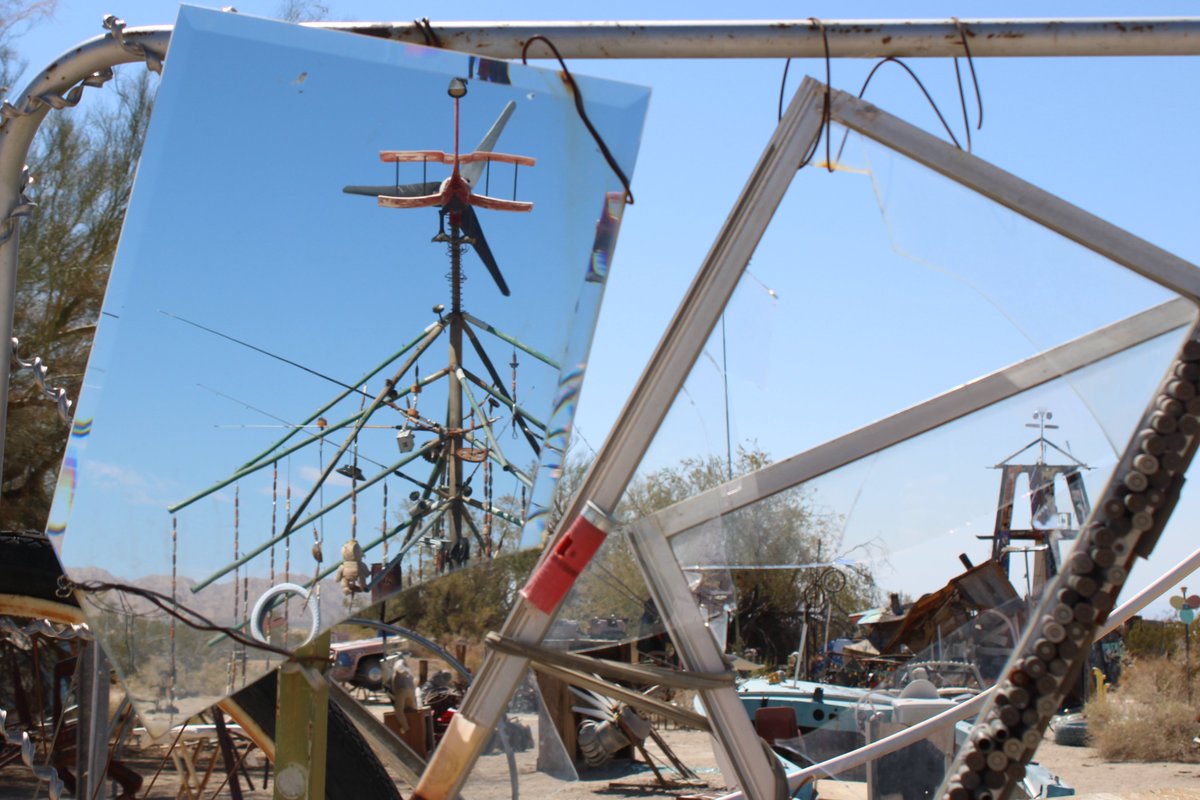AustinHleake's tweet photo. The propeller blades spin in rapid intermittent bursts as gusts of desert wind cut through East Jesus, a small community of artists near Slab City.
#popupnewsroom #swc #breakinnews @popupnewsroom https://t.co/ItB25pXAZo