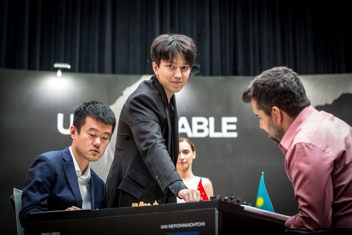 FIDE_chess's tweet photo. Today, Dimash Qudaibergen (@dimash_official), Kazakhstan's biggest superstar, made the first move in game 12. #NepoDing https://t.co/Px0Bk2lDej