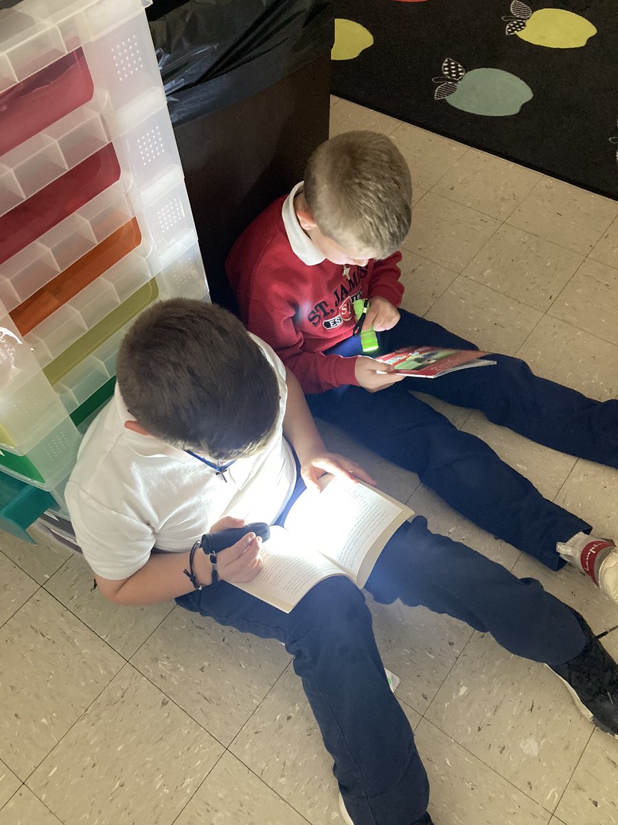 MrsBarlowSTJ's tweet photo. F is for Flashlight Reading 🔦 The students read with their flashlights during buddy reading yesterday! 📚 https://t.co/6sQOLVWdNR