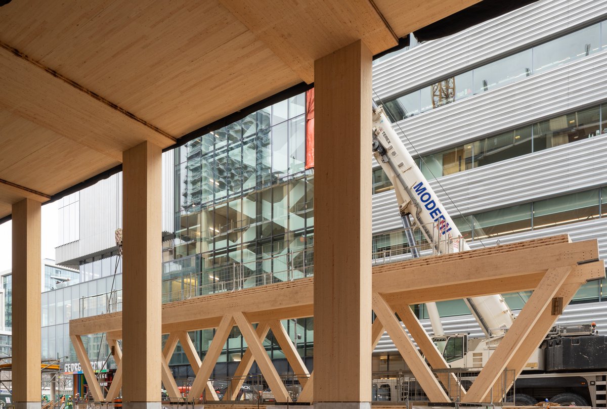 ConstructCanMag's tweet photo. PCL installs mass timber pedestrian bridge at George Brown College’s Limberlost Place @PCLConstruction @moriyamateshima @actonostry https://t.co/L7Q425wG17 #bridge #building #carbonemissions #cltpanels #georgebrowncollege #limerlostplace #masstimber #netzero #pedestrian #prefab https://t.co/KXZ10b08Td