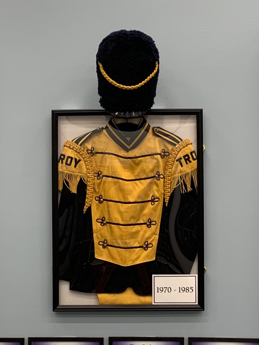 TBHSBands's tweet photo. The band directors have been working on a project celebrating the history and tradition of the Buchanan/Troy Buchanan High School Band. We think it was a great addition to our room.  If you were in the BHS/TBHS Band, let us know which uniform you wore when you were in high school https://t.co/AE8MkCU14K