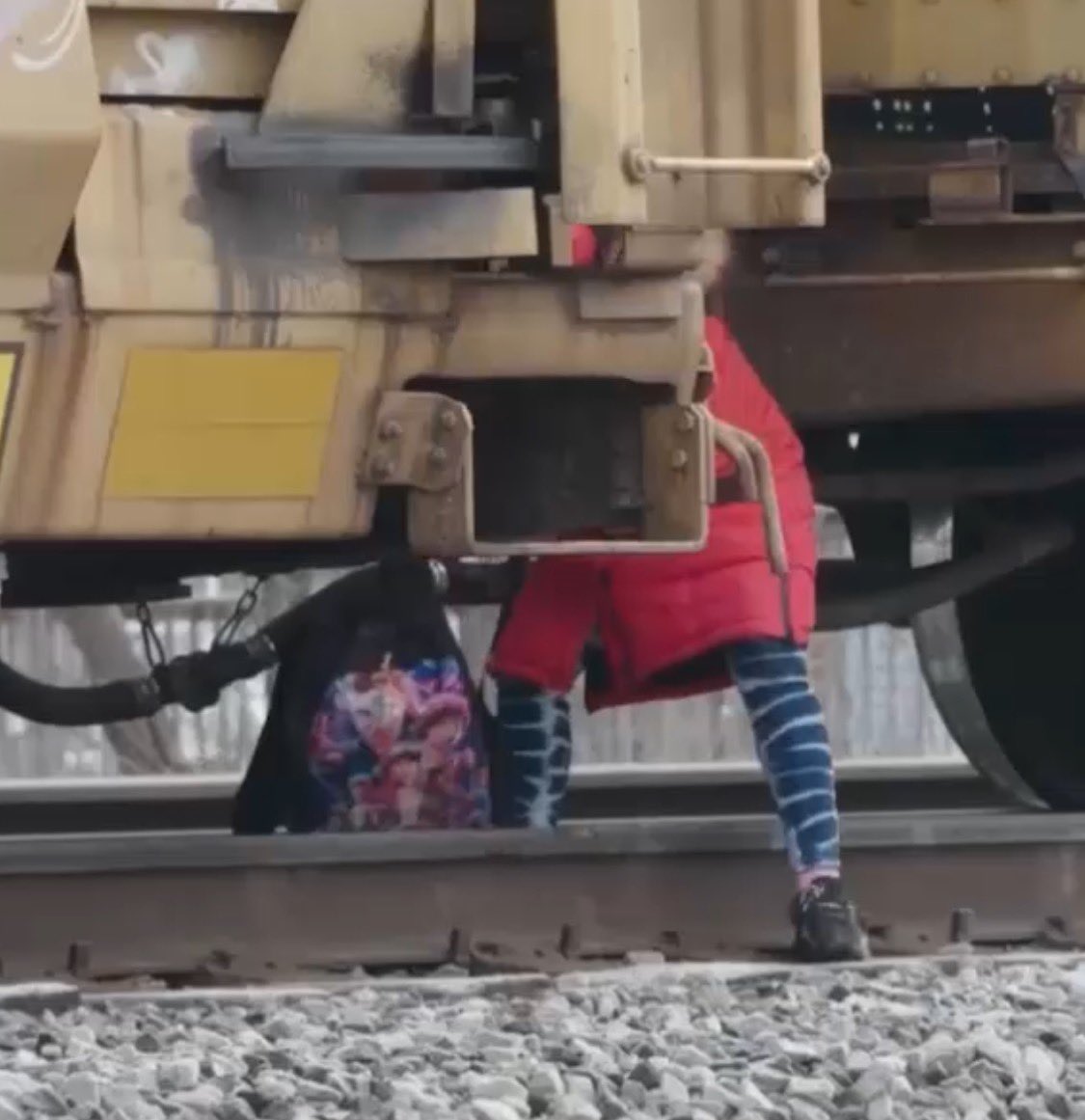 megreenwell's tweet photo. Lotta bad things in the world, but these @propublica photos of kids who have to risk their lives by crossing over or under stalled trains *to get to school* really did a number on me today. https://t.co/MDImQJGX5s https://t.co/86qTgP1OWV
