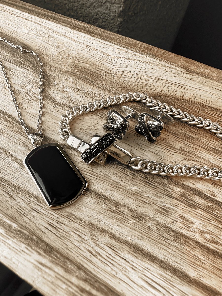 When you mix bold styles with classic pieces, you get @yknot.jewelry. DM me to make an appointment for your next piece ✨ #jaredemployee #yknot #dogtags #dogtag #loveknot #silverchain #chains #Groomsmen #GroomStyle #groomsmengifts #jewelryphotography