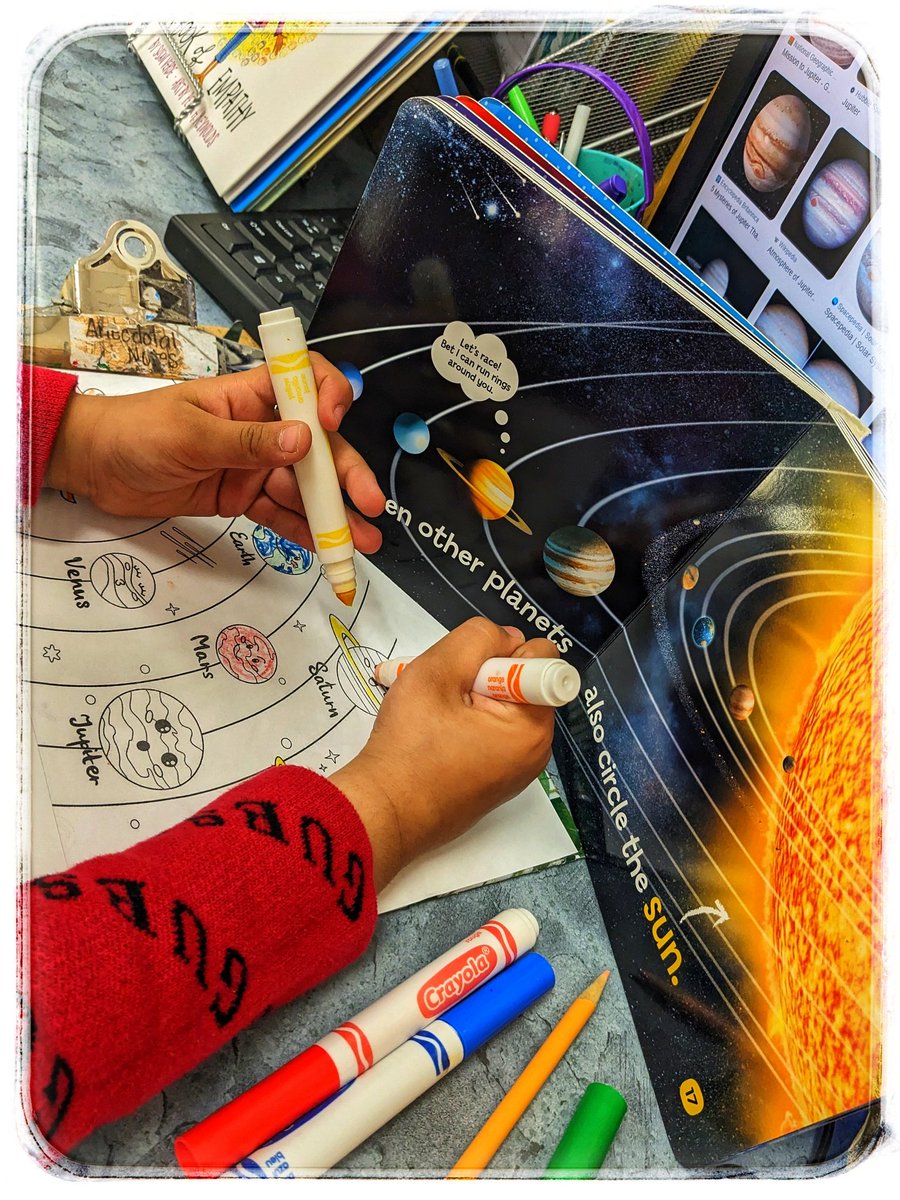 #EarthDay2023 led our children to start asking questions about the other planets. We celebrate an #InquiryMindset in our #Kindergarten class. And, there are times when a paper graphic is okay to use. Student A is copying the colors she notices in book and computer images.