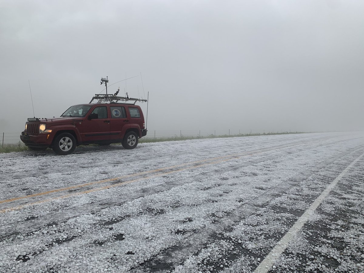 IanMalicoateWx's tweet photo. Large hail covering the roadway 10 miles northeast of de Leon Texas @ryanhallyall @NWSMidland https://t.co/1yPqOs9UFP