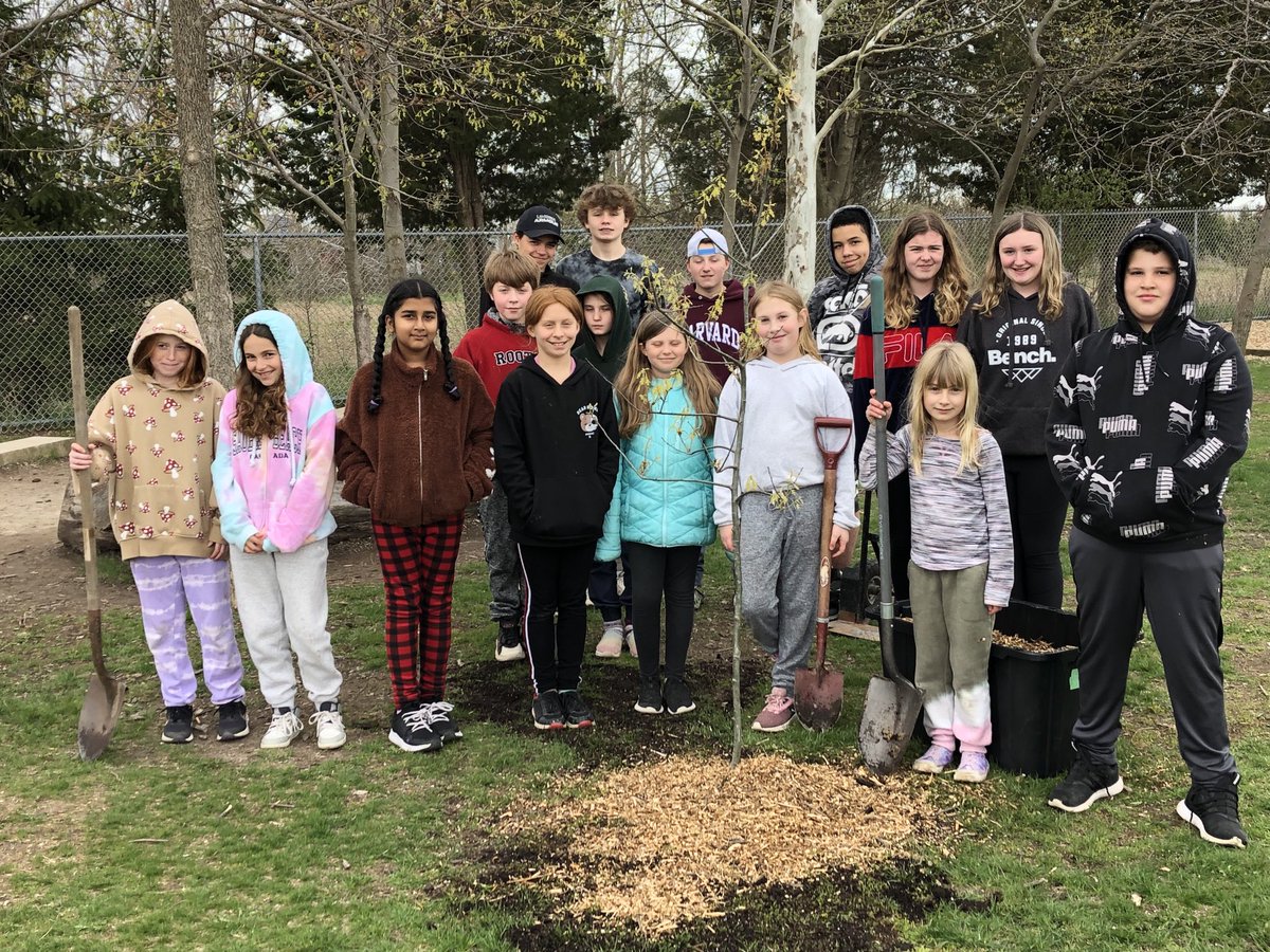 ECO team planting another tree at the school for Earth day.