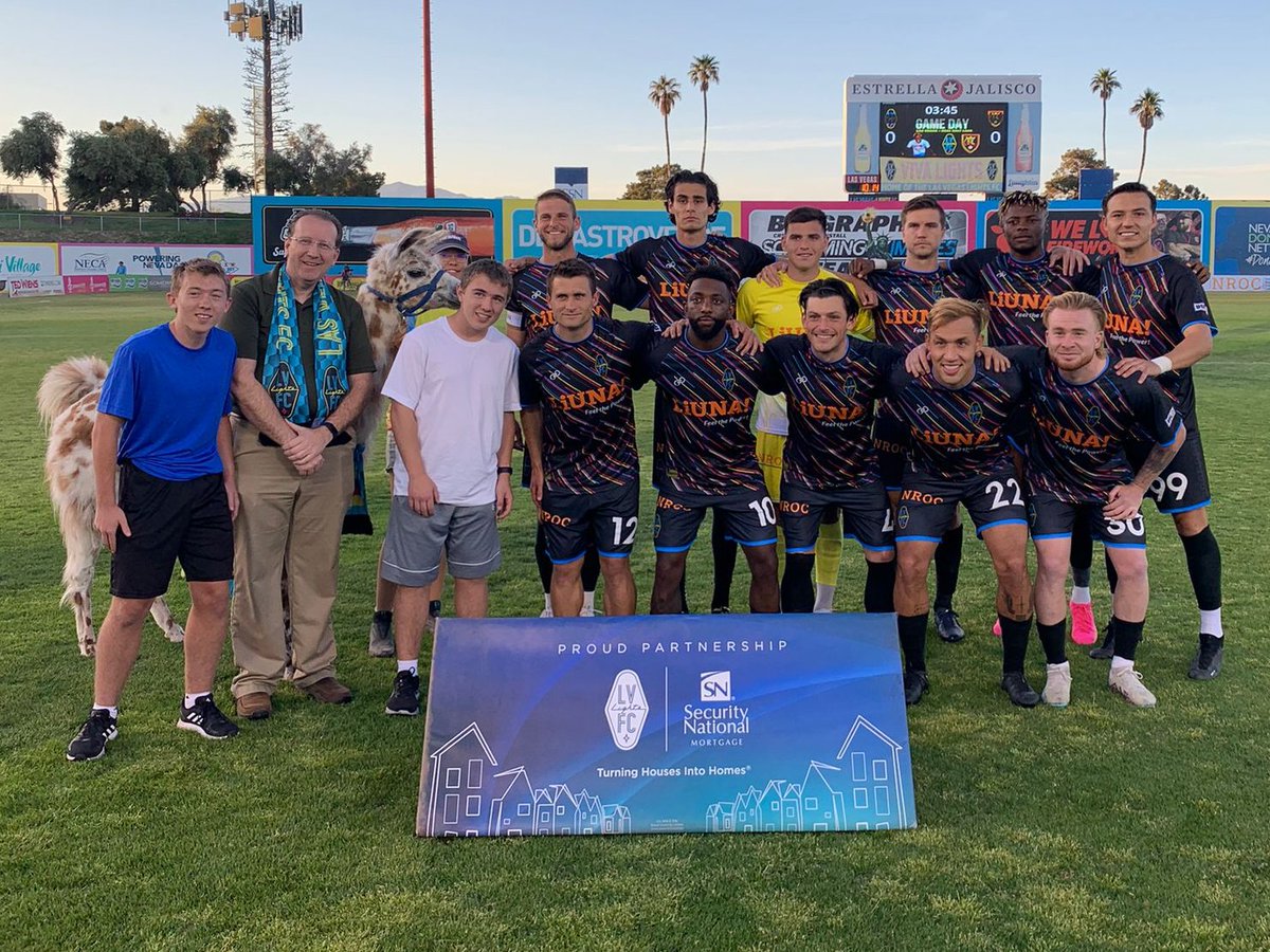 lvlightsfc's tweet photo. Our first #StartingXI photo at Cashman Field this year with our squad, our season ticket holders and DOLLIE LLAMA 🦙

#VivaLights ⚽️🎉 | @SNmortgage https://t.co/rMvu4MMDy2