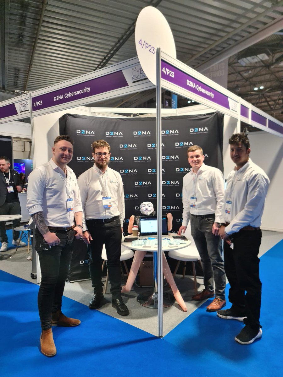 D2NA's tweet photo. We are ready to go for Day 3 of the @NCSS_Cyber. 

Come and say hello and see what's under Clive's mask!

#NCSS2023 #d2na #cybersecurity https://t.co/3lJdqF1MHq