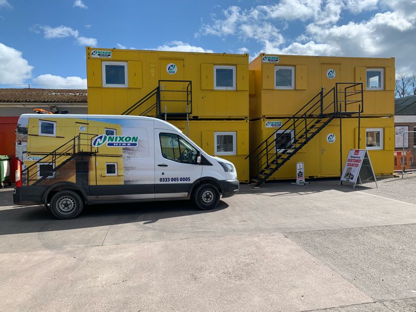 NixonHire's tweet image. A great picture showing a nice compact setup of a few stacked site accommodation units at a customer’s site in Dumfries – matching one of our Mobile Fitters vans too! Great effort from the team at our Carlisle Depot as always! #hirethatworks #nationwide #sitesetup