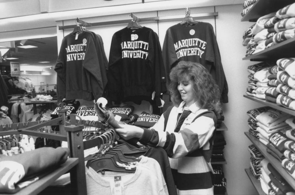Student inspects merchandise in Alumni Memorial Union Bookstore, 1991.
- MU Archives