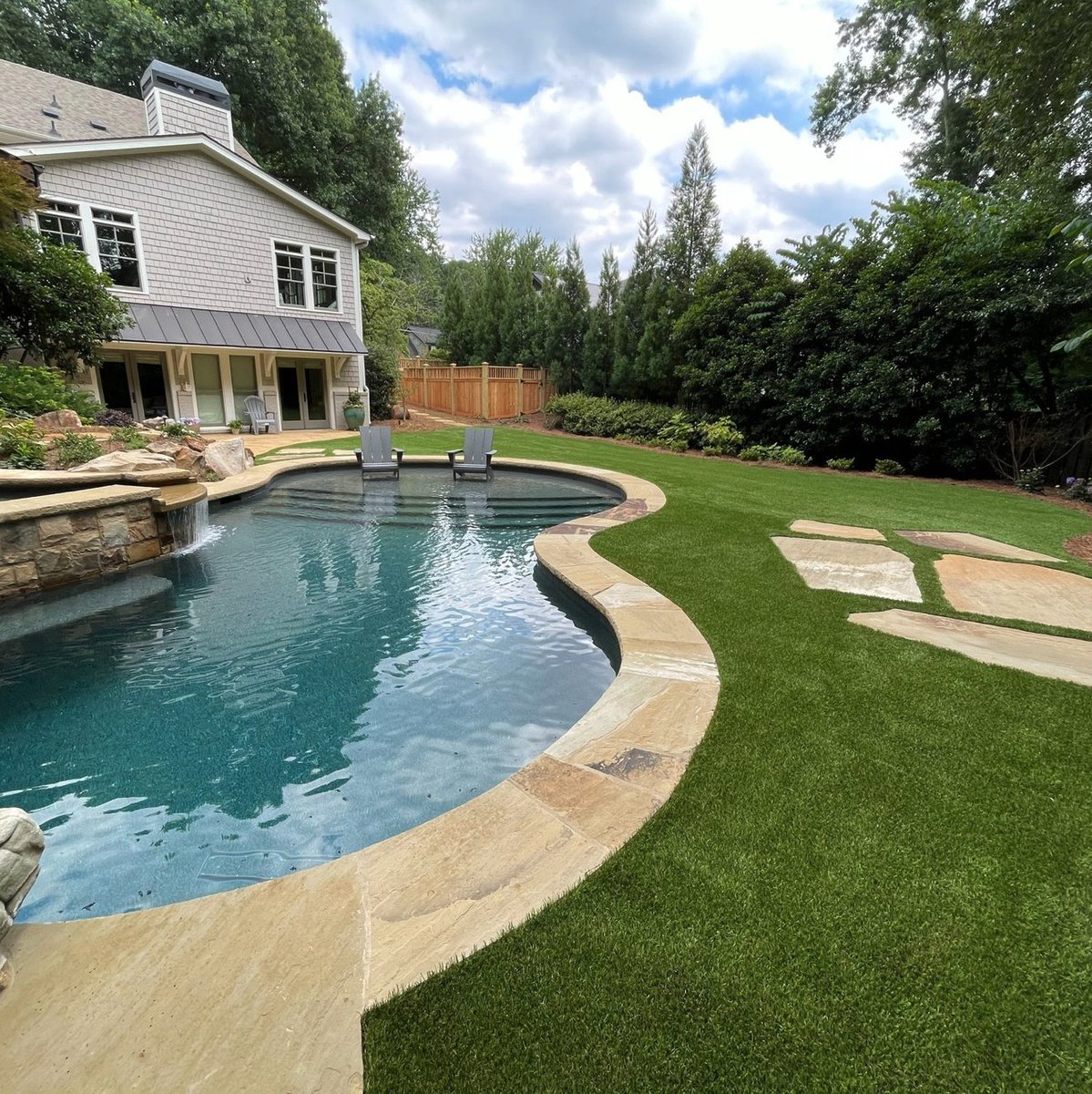 Turn your backyard into a poolside paradise. 🏊‍♀️ With ForeverLawn Landscape, your space is ready for any weather—so you can lay out instead of waiting for your yard to dry out. ☔ Get a slip-resistant solution without sacrificing your poolside aesthetic: foreverlawnlandscape.com