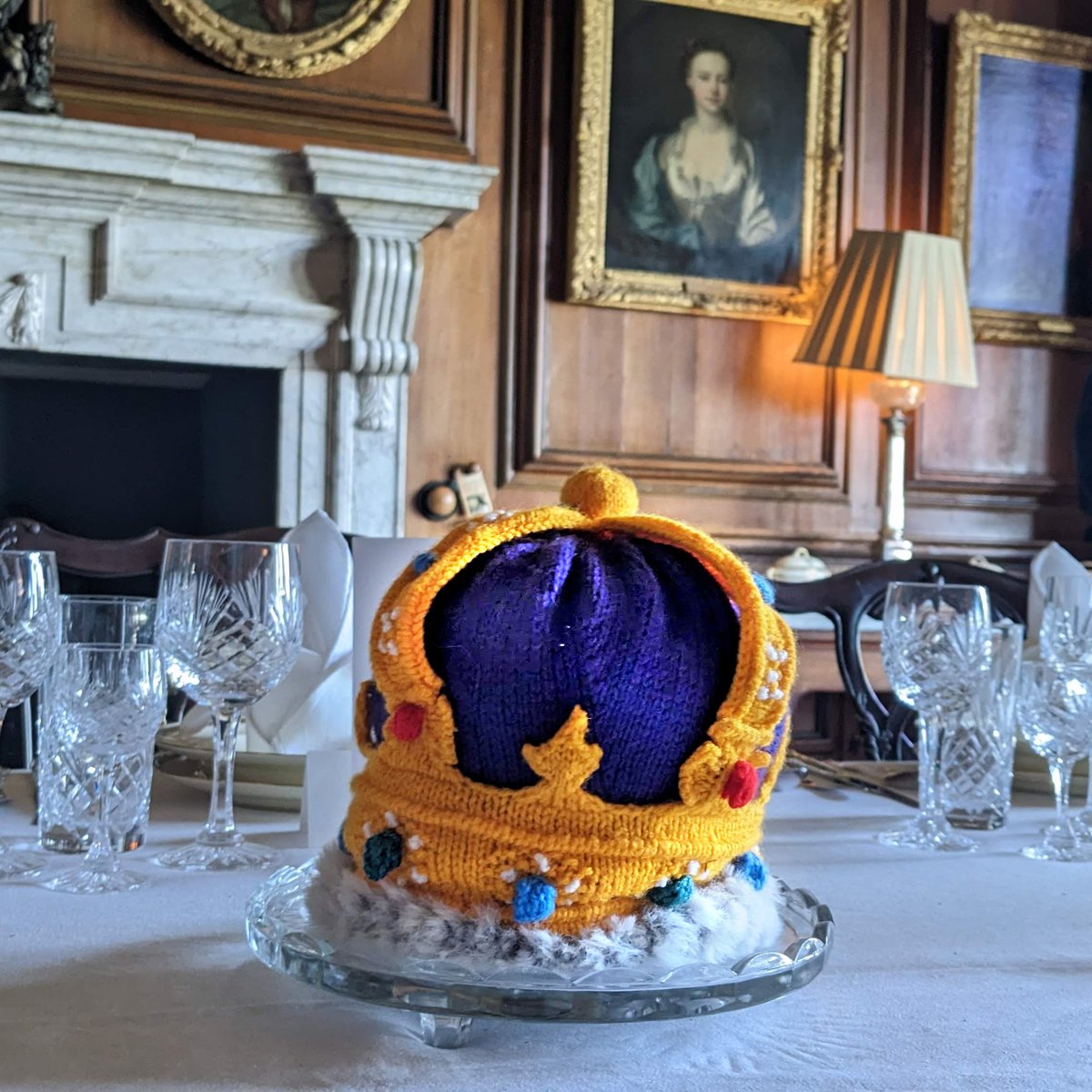 It's only a week until the coronation and it's looking rather regal in the castle 👑 

Knitted by our brilliant volunteers, there are crowns hidden all over the house for you to spot. Come along and see if you can find them all 🔎