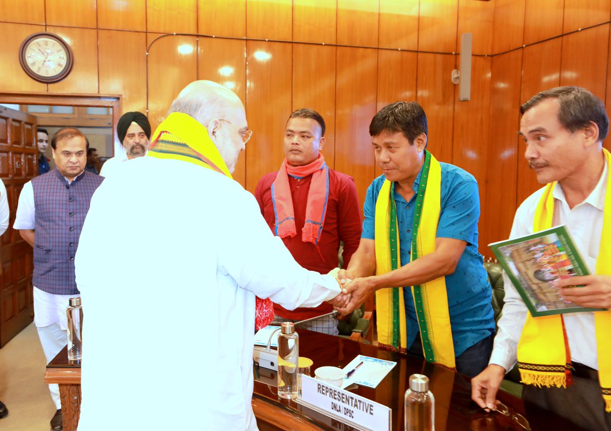 AmitShah's tweet photo. Another momentous day for Northeast. Government of Assam and Dimasa National Liberation Army signed a peace accord today for permanent peace. The DNLA has laid down arms expressing trust in the way PM @narendramodi Ji has established peace and ensured development in the region. https://t.co/pB6XMr1UcX