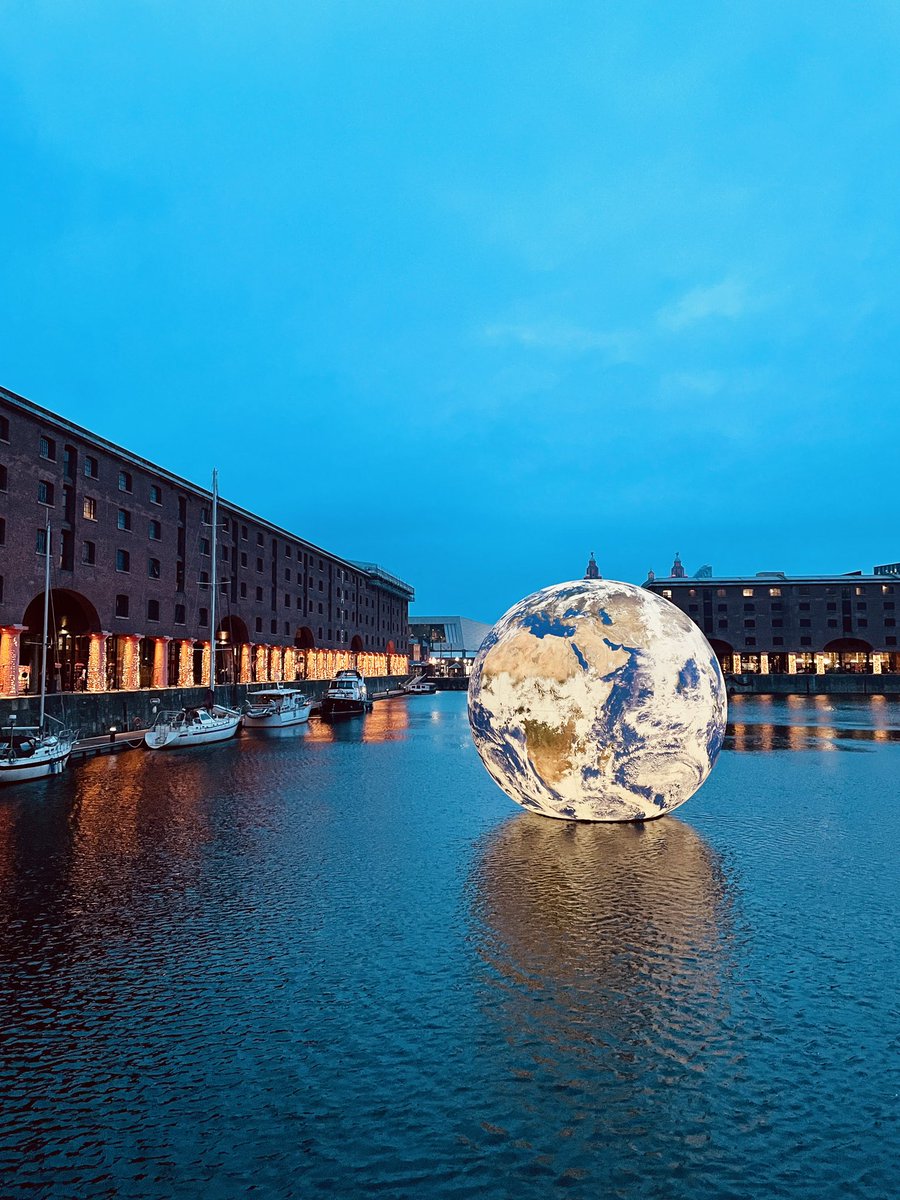 VisitLiverpool's tweet photo. Royal Albert Dock welcomes the world! 🌍

‘Floating Earth’ has arrived at @theAlbertDock and you’ll be able to see it right across #Eurovision in Liverpool! 

Find out all about it ➡️ https://t.co/DL96vsrCSg https://t.co/a2KmH2rhLm