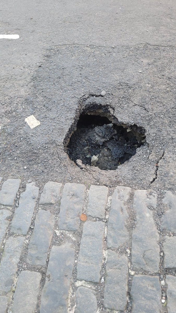 aadavies's tweet photo. @GlasgowCC I'd hate to see some of the potholes that are worthy of 'action'. 

Granted, it now has some cones around it, but I reckon that's only because the entire Duke of Wellington statue is hidden down there!

@NorthKelvinCC https://t.co/akPAR7lCZo
