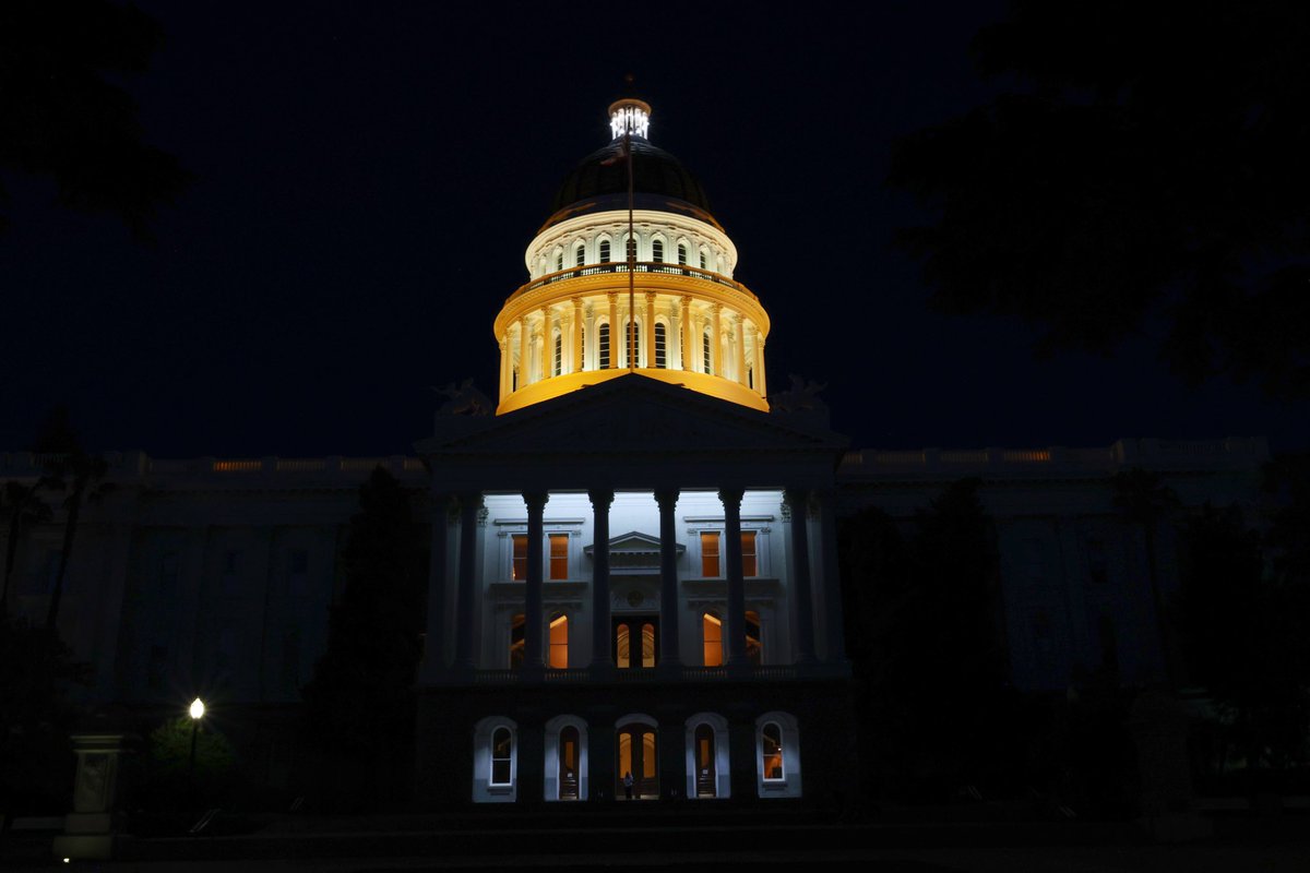 CAgovernor's tweet image. On @CaltransHQ Fallen Workers Memorial Day, we light the Capitol building orange to honor the 191 civil servants who lost their lives keeping Californians safe on the road. #BeWorkZoneAlert #MoveOver