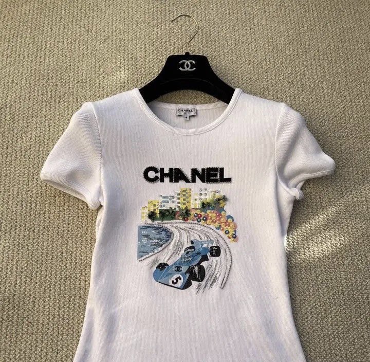 Everything we know about Madeleine White's viral Chanel F1 shirt