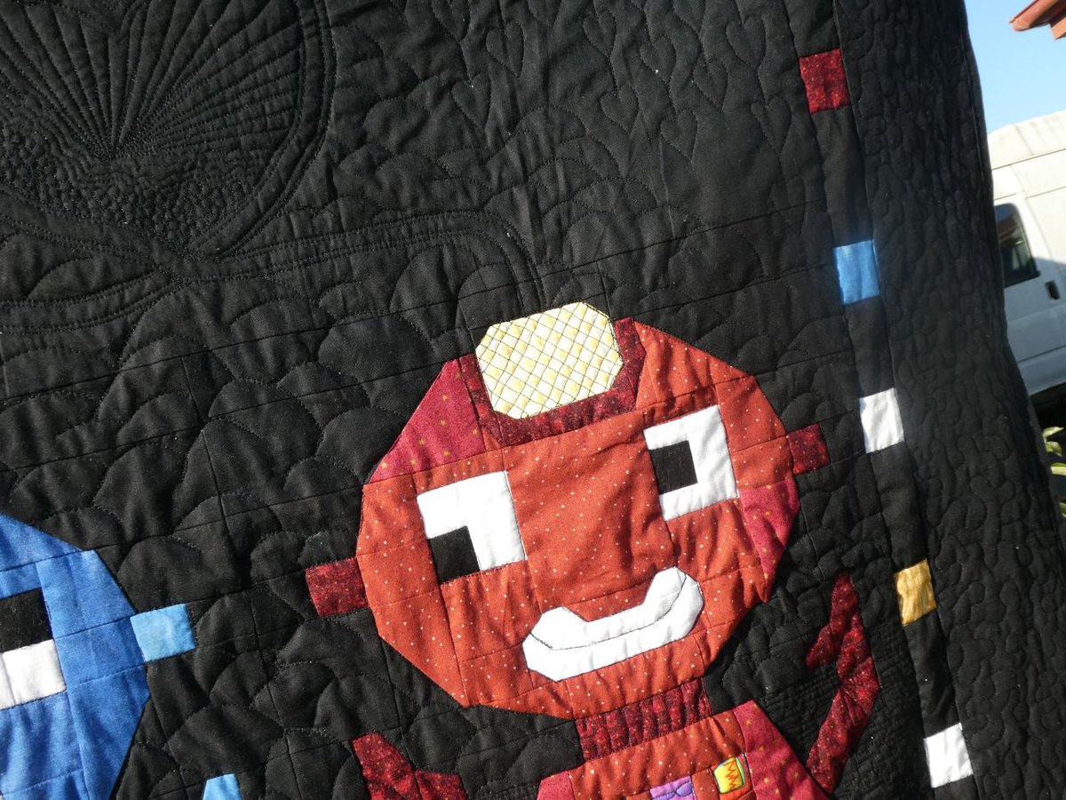 I designed the piecing pattern using quilting assistance program inspired by a bookmark cross stitch kit I have. Pieced it together on my brother machine and quilted in on my capri long arm machine