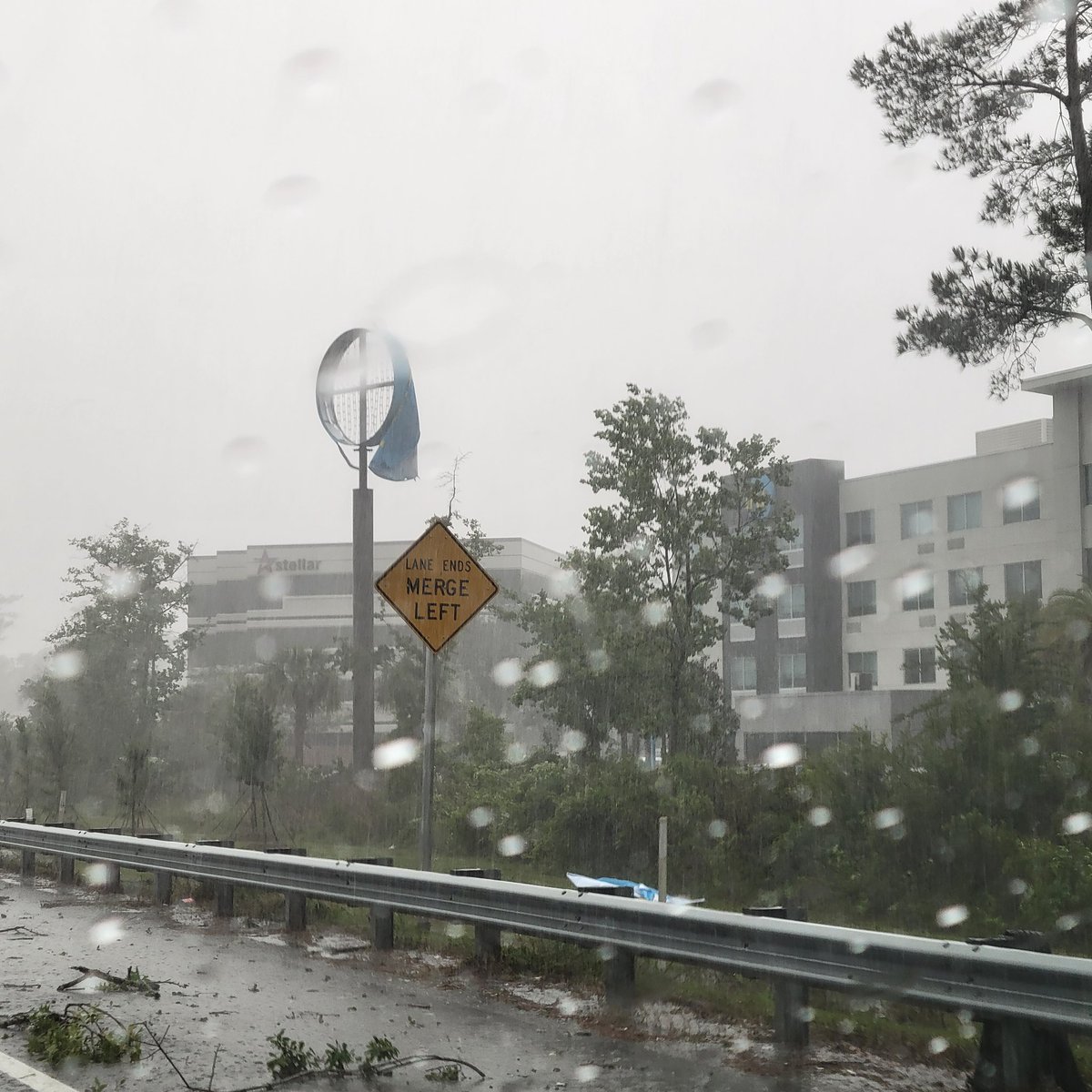 Tinkerbell1756's tweet photo. @MikeFirstAlert @ActionNewsJax @WOKVNews We were stuck on the on-ramp from San Jose to I-295 North/West. It felt like we were in a hurricane with the strong wind &amp; rain hitting car. Tree limbs, leaves, and debries all over. Tru by Hilton had their sign torn up. Do you know if they closed the Buckman? https://t.co/lOL8VXzgHQ