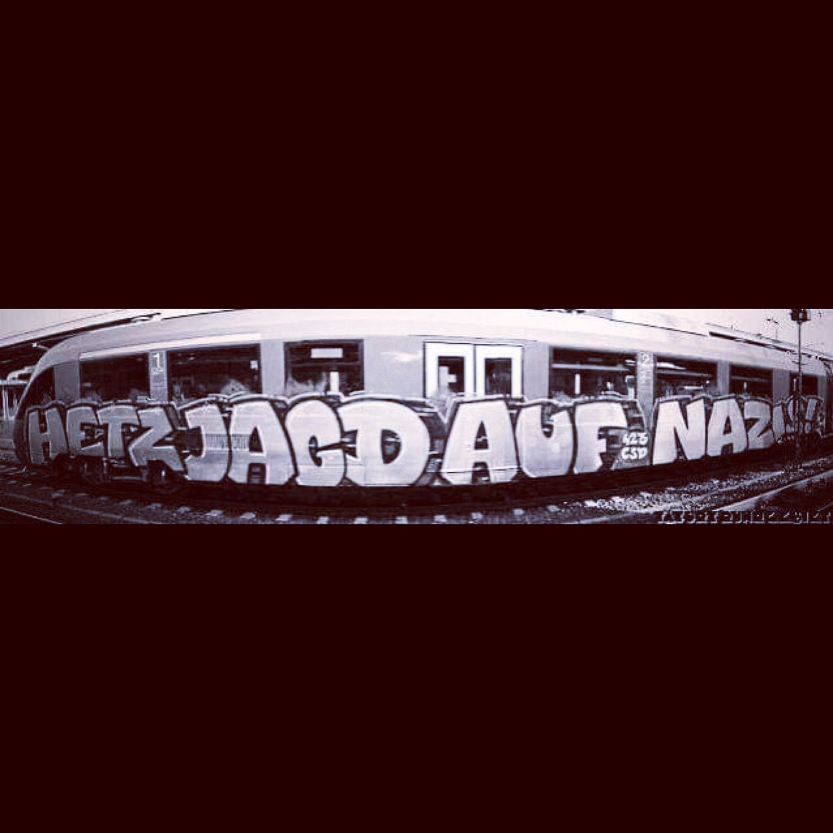 AlecEmpir3's tweet photo. In 1992 I wrote what is considered the ‘first anti-nazi techno track’ in the music history books …. “Hetzjagd Auf Nazis!” (English ‘Hunt Down The Nazis’)  - so to see a graffiti artist spray-paint this onto a subway train was amazing to see 💥🔥🏴 #alecempire #atariteenageriot https://t.co/81RHtIgkv6