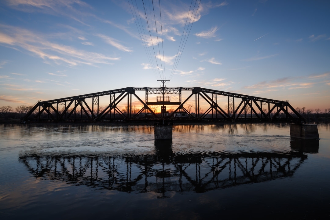 notleyhawkins's tweet photo. Swing Bridge in St. Joseph, Missouri. Photography by Notley Hawkins. #missouri #kansas #missouririver #stjoseph #river #riverbank #water #reflection #sunset #swingbridge #bridge #steelbridge #railroadbridge #trussbridge #notleyhawkins https://t.co/xiQEV6Kno0