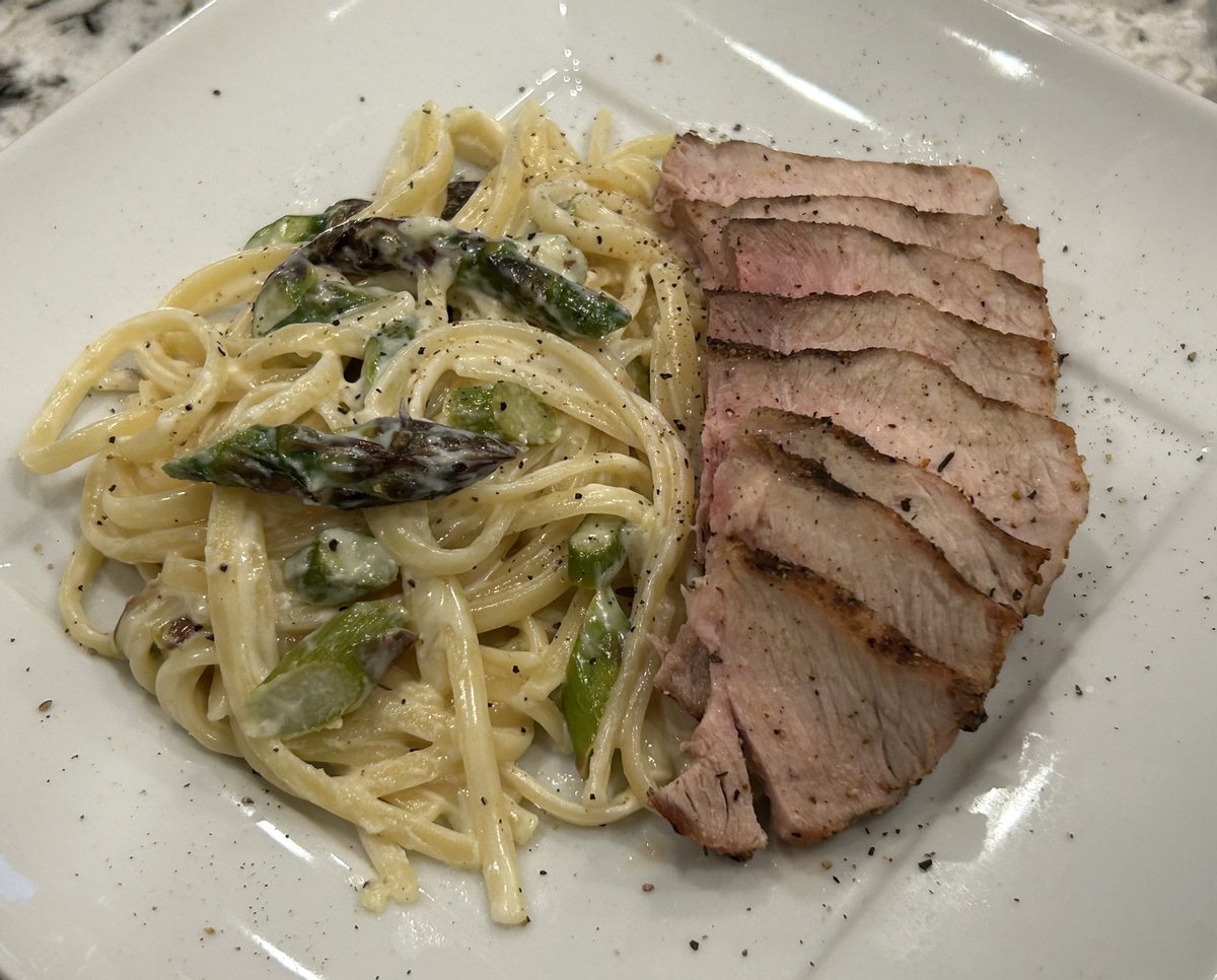 LAB019's tweet photo. I still had asparagus and a pork chop, so just like the great American composer Aaron Copland, I present a โvariation on a themeโ. Grilled pork chop and thin linguine with sautรฉed asparagus in an Alfredo sauce. #CulinaryComposer https://t.co/CTlEyS66B2