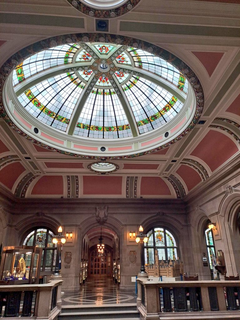 Civic entrance with stained glass dome in roof/ceiling. 