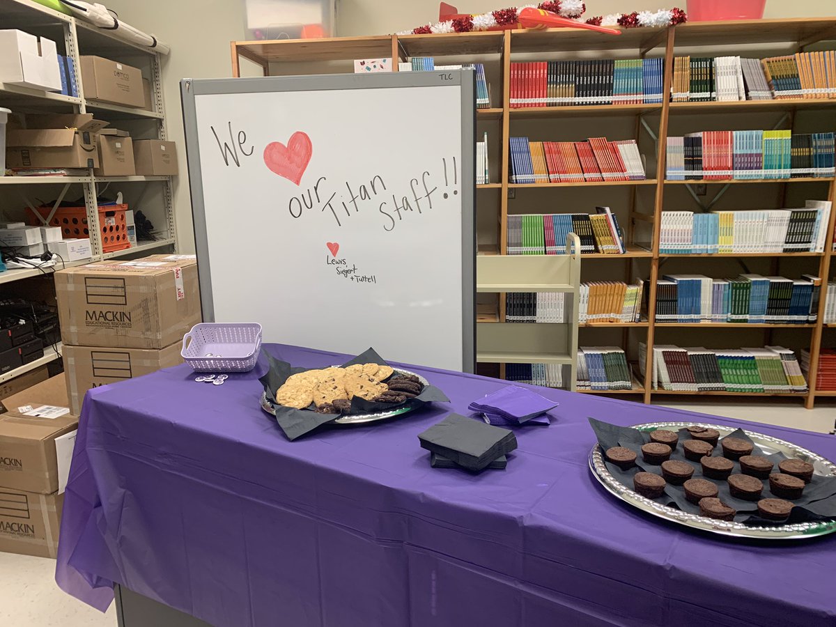 SGHS_TLC's tweet photo. In celebration of ❤️ your library month we are celebrating our @SouthGarnerHS staff. Sweet treats & #TitansREAD buttons. @SEasternArea @wcpssdll @ChrisTuttell @aasl @NCSLMA https://t.co/qgGBDo1FQ1