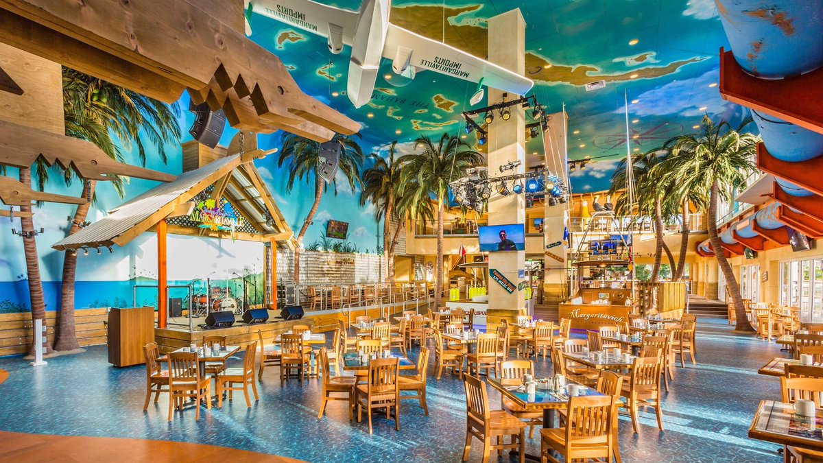 the_transit_guy's tweet photo. Every city in America larger than 100k people will be connected to a national transit network that's frequent and fast, BUT, all existing and new stations would have to look and sound like the inside of Margaritaville. Are you accepting the deal or keeping things as is? https://t.co/0uVf46yfFV
