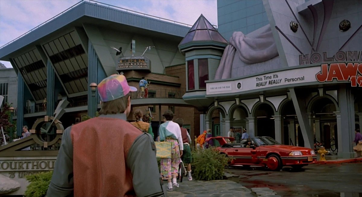 Gibboanxious's tweet image. You sure, Mr. ImNotMead???

I thought in #BackToTheFuturePartII on October 21, 2015, Marty McFly saw a futuristic hover-converted red Mustang convertible land in Hill Valley's Courthouse Square and stop in front of the Holomax Theater.
How come you think it's actually a BMW 633?