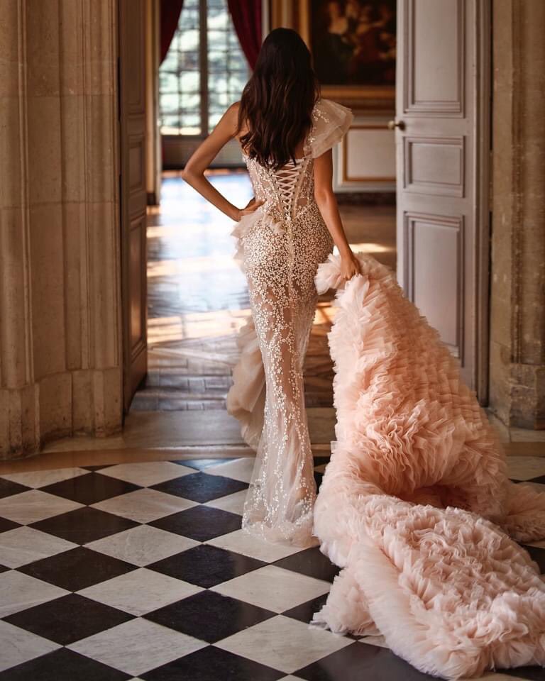 Xiaothao_Hong's tweet photo. This ultra-feminine #MillaNova mermaid wedding dress features a corset bodice bathed in hundreds of light-catching sequins and beading throughout the entire gown with a daring side slit on the skirt decorated with dramatic ruffle detailing. https://t.co/PihwixvrYy https://t.co/bxGmBId59E