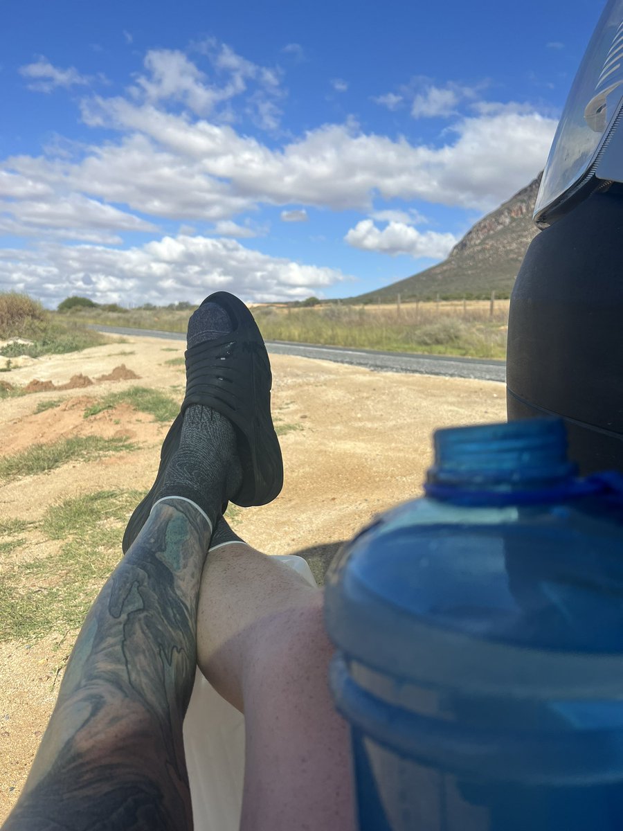 hardestgeezer's tweet photo. 35km smashing tarmac so far today. Nothing but snake infested bushes for shade cover.

Boys came and met me with the van. Using the door to make shade &amp; protect my ginger skin from getting pieced up.

Gonna chug a couple litres of the finest h2o and get back on road stomping. https://t.co/AXqwBXpwzW