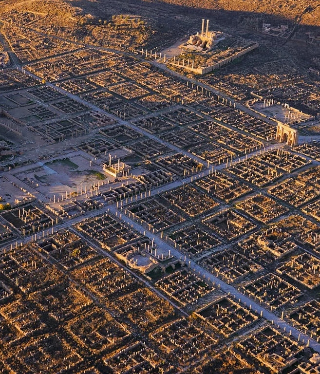 This is the city of Timgad in Algeria, built by the Romans nearly 2,000 years ago.

Though the grid plan might seem like a modern invention, it's ancient.

From the Aztecs to the Egyptians, from Greece to China to the USA, here's why your city is (probably) built as a grid...