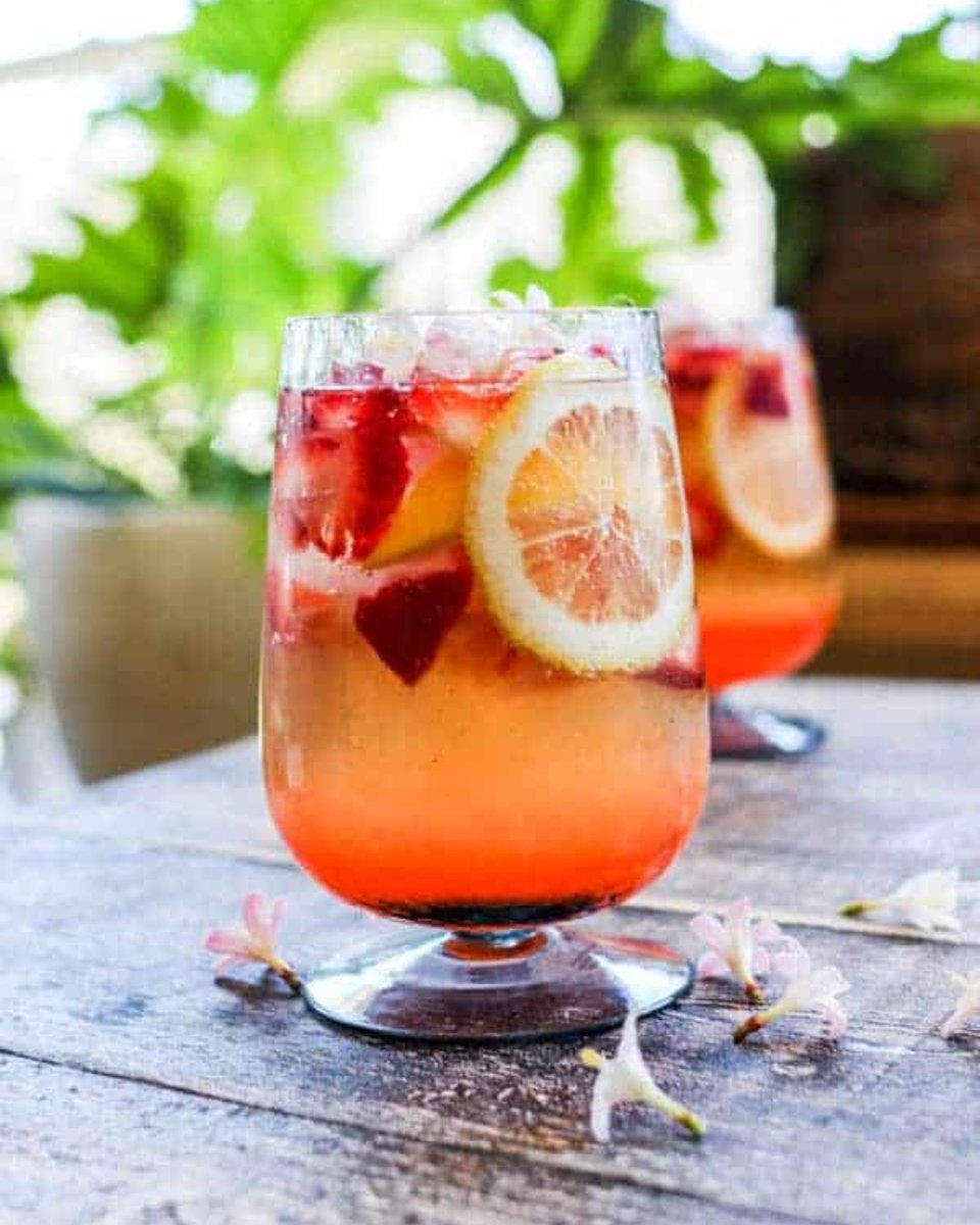 This summer sipper has the perfect ratio of tart + sweet with freshly squeezed lemon juice and luscious berries. It's topped off with CA sparkling wine which gives it that irresistible fizz factor! 

Get the recipe from <a href="/ThisMessIsOurs/">This Mess Is Ours</a>:  thismessisours.com/strawberry-lem…"