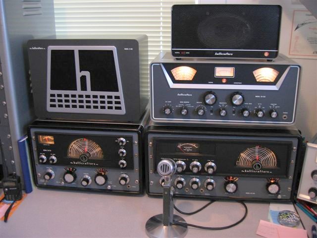 Hallicrafters HT-32 and matching SX-115 receiver operating station. Extra SX-122 receiver on top of the HT-32.