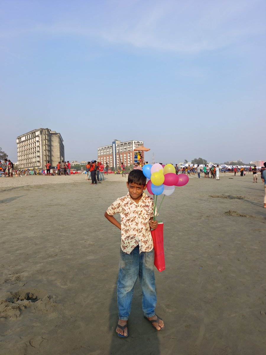 Two little children from Bangladesh are selling balloons in the Cox's Bazaar beach, it is the age of study, Bangladesh is a country where mostly child labour are happening mostly. 
#childcare #ChildHealth #StopChildLabor