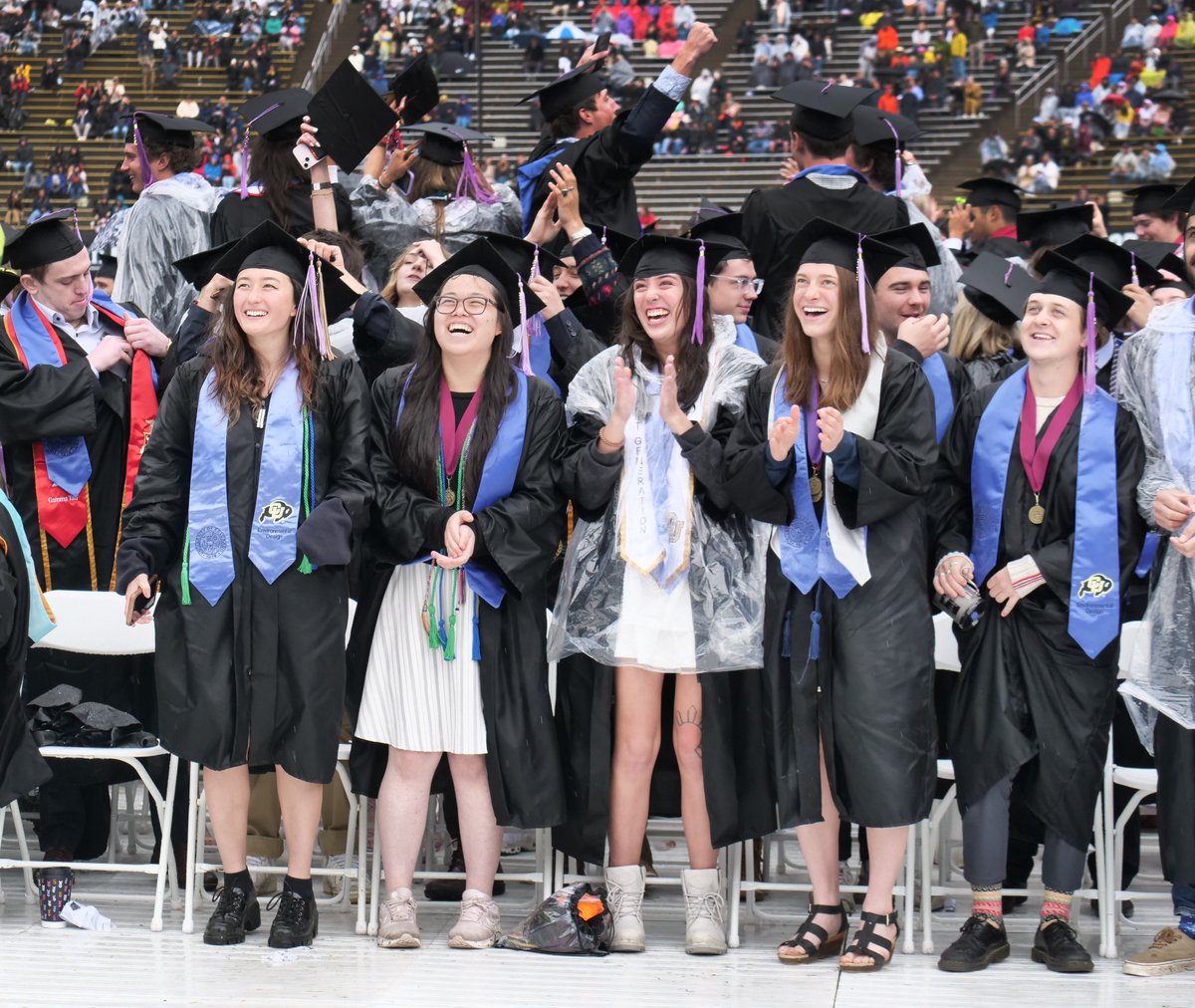 CUBoulder's tweet photo. Damp and degreed! ☔️🎓  

Congrats to the newest #ForeverBuffs 💛🦬🖤  

📸: the wonderful SRC photo staff https://t.co/q8a1BkbssB