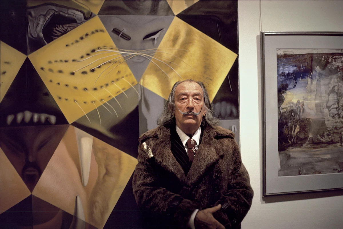 Photo: © Jeff Koons. Dali posed after preparing himself by twirling his moustache upwards in front of his Royal Tiger painting. 