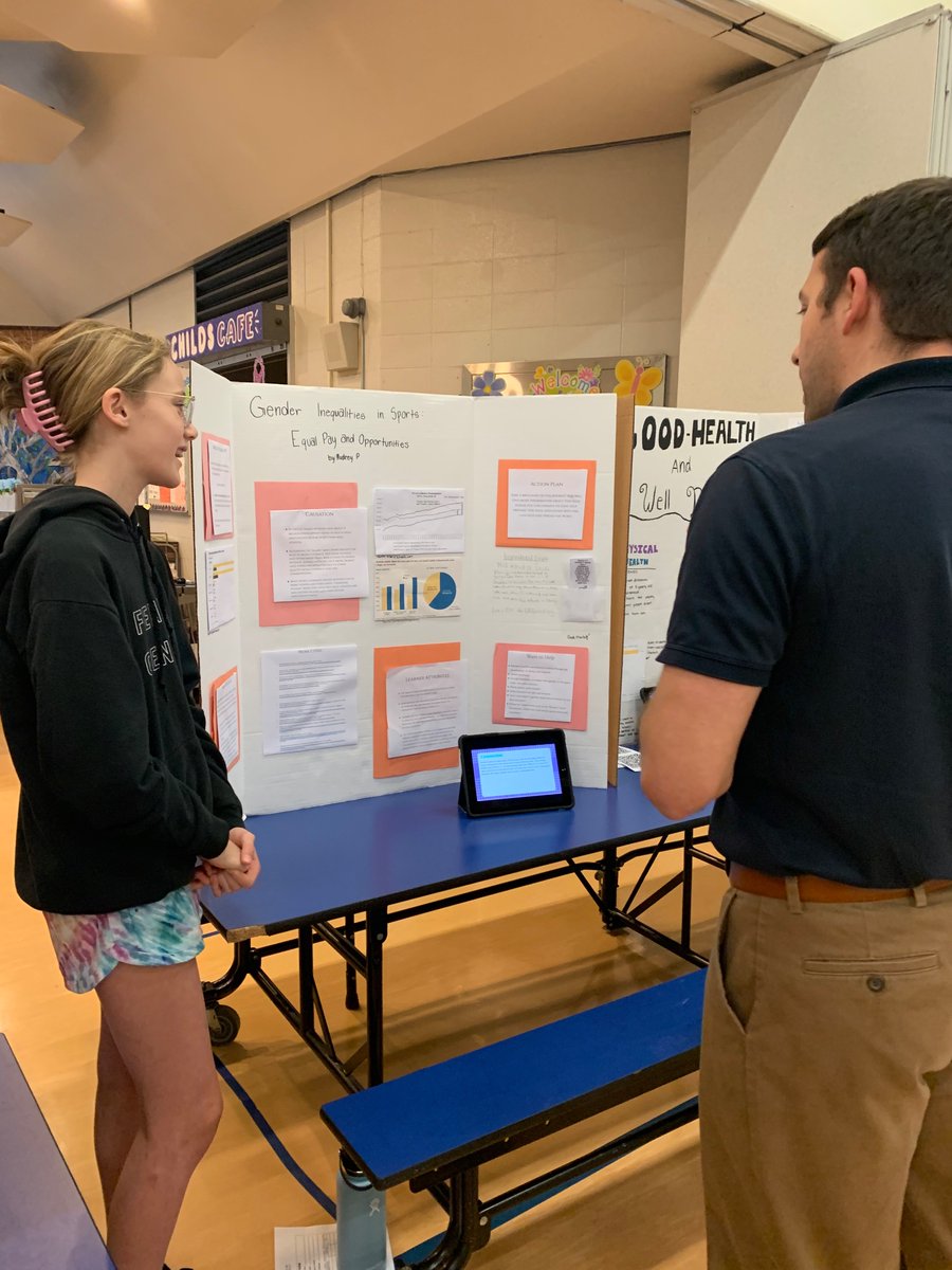 Mr. Marshall listens to this student share her research on #GenderInequality #PayGap