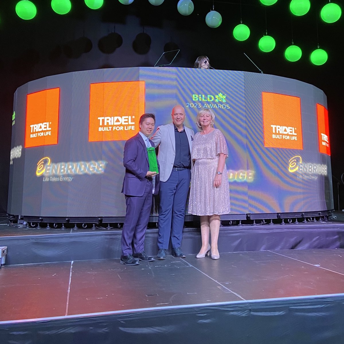 tridel's tweet photo. We are honoured to receive the Green Builder of the Year Award from @bildgta. 

At Tridel, we remain steadfast in our commitment to reducing our carbon footprint, improving our construction practices, and building environmentally responsible places to live. https://t.co/4IWkHOiFac