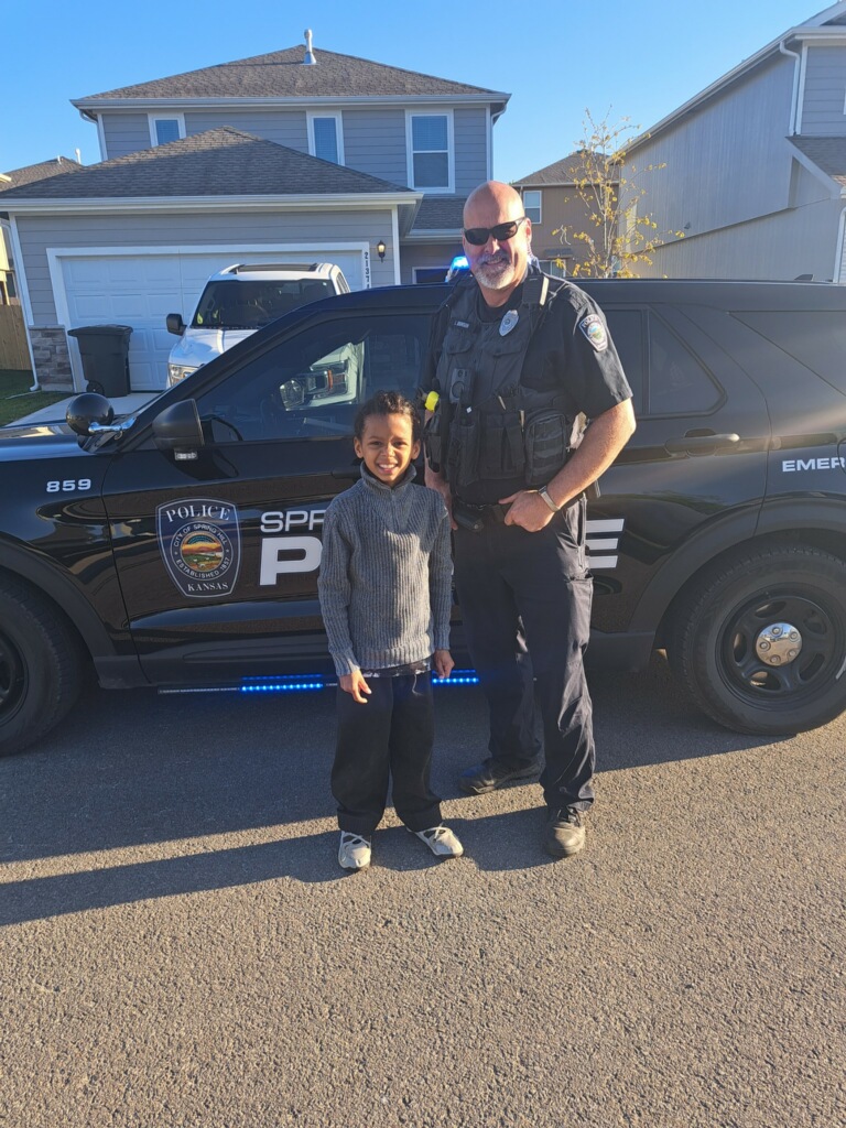 A memory to last a lifetime! 🚓📓✏️ Silas won a ride to school with a police officer. Last week, the day finally arrived and Officer Johnson picked up Silas to go to school. He got to enjoy the light and sirens and check out the police car!