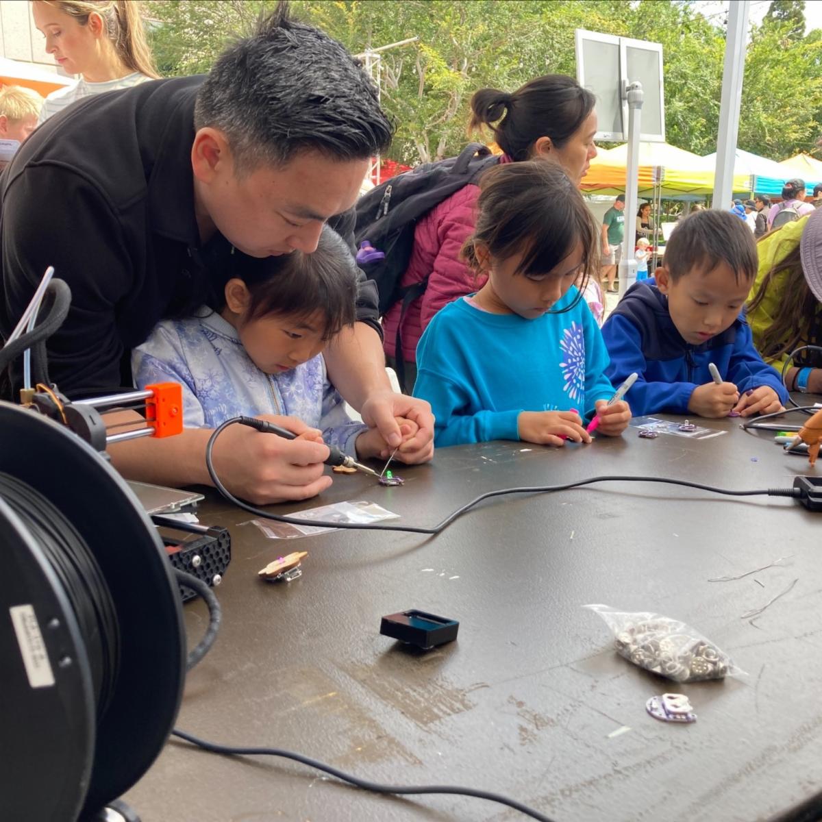 Over the weekend, IPSF participated in the Beckman Science and Art Festival. At IPSF's booth, Woodbridge High School student’s from the Makerspace Team led an exciting activity that allowed guests to make their own light-up creation!